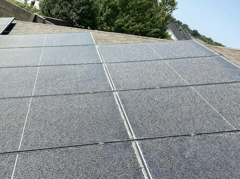Rooftop solar array before and after cleaning (before)